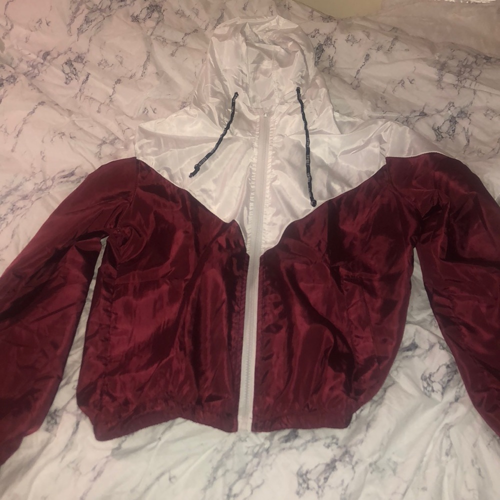 red and white windbreaker